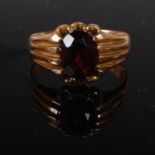 A vintage 9ct gold and garnet single stone ring, the stone loose, gross weight 5.7 grams.