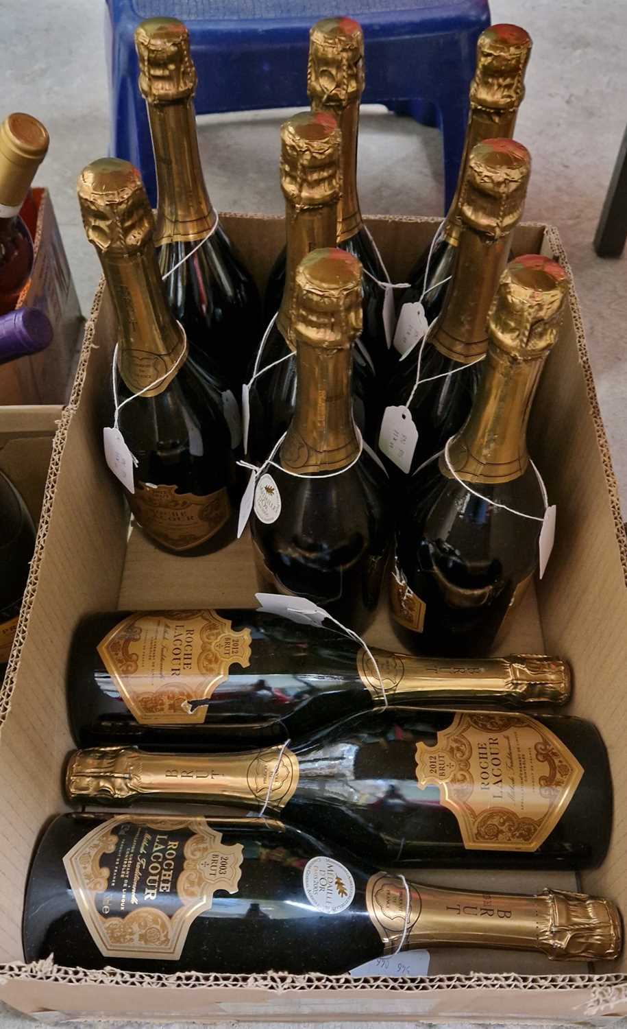 Eleven bottles of Roche Lacour brut, comprising four 2003 bottles and seven 2012 bottles, all