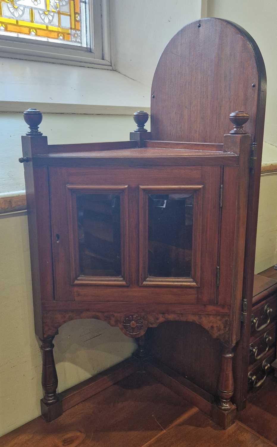 An Edwardian walnut dressing chest with two hinged mirror plates, two glazed cupboard doors, the - Image 2 of 2