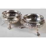 A pair of Victorian silver salts, London 1861, makers mark R H, engraved with initials, embossed