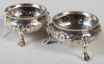 A pair of Victorian silver salts, London 1861, makers mark R H, engraved with initials, embossed