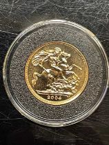 A 2004 Elizabeth II gold sovereign.