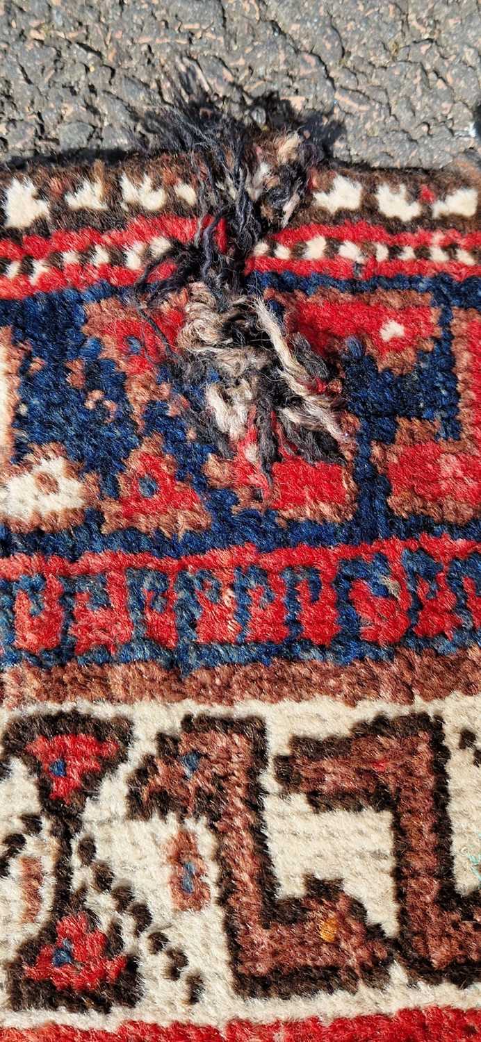 A Persian rug, 20th century, the rectangular field centered with three blue ground lozenge shaped - Image 4 of 5