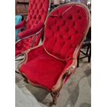 A Victorian mahogany parlour chair with red button down velvet upholstered back arms and stuff