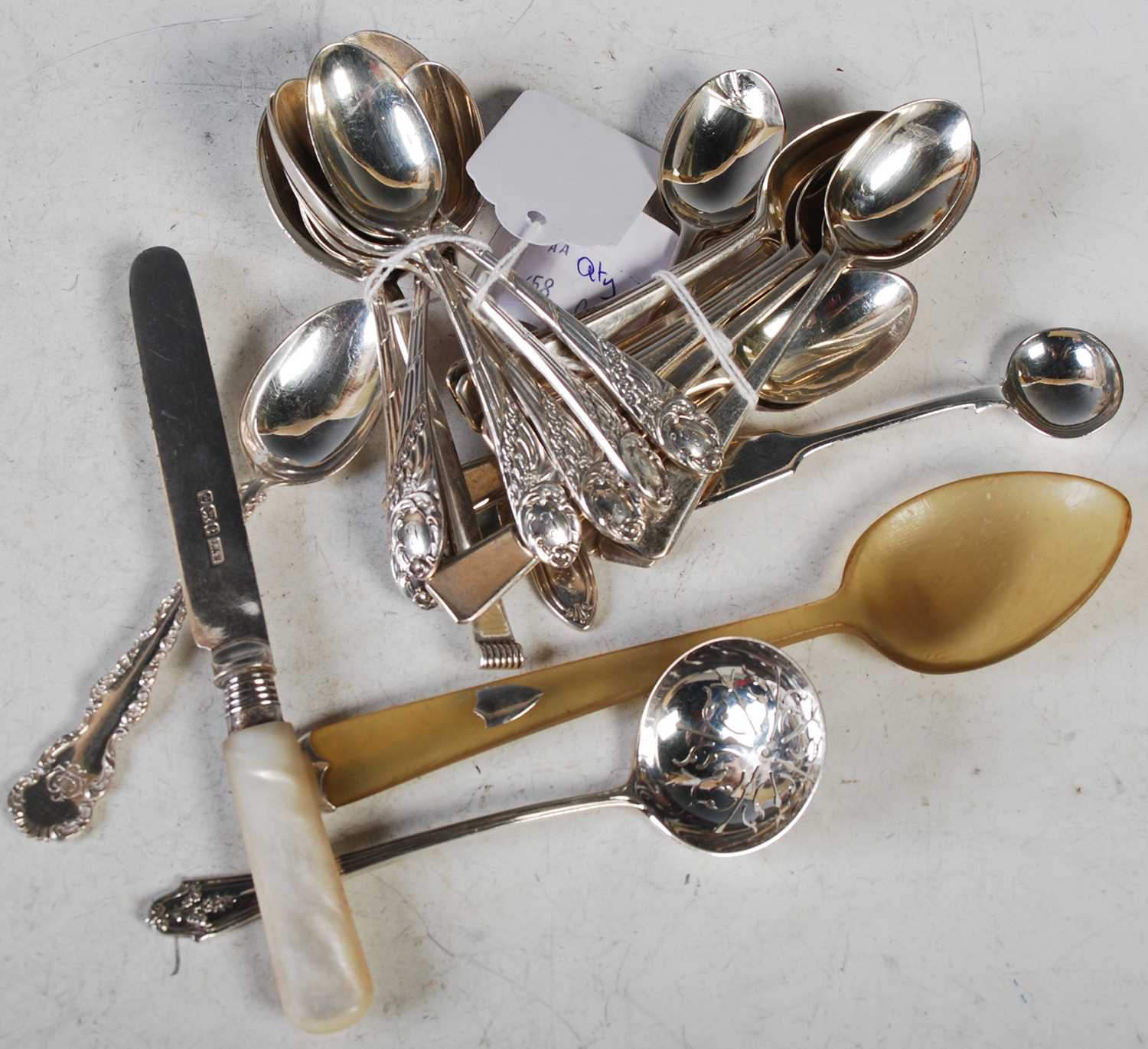 A collection of assorted silver to include twelve London silver coffee spoons, six Sheffield