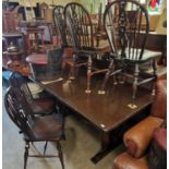 A 20th century dining room suite comprising sideboard, refectory table, and six spindle back side