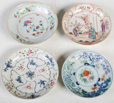 A collection of four assorted Chinese porcelain saucer dishes, Qing Dynasty, one decorated with