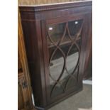 A Georgian mahogany corner cupboard with astragal glazed door opening to three fitted shelves, 109cm