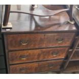 An early 20th century walnut chest fitted with three long drawers, raised on splayed bracket feet,