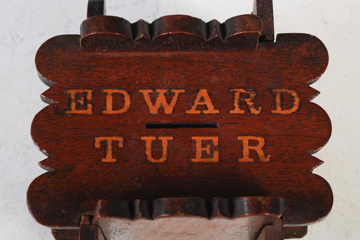 A mahogany puzzle money bank inscribed ‘Edward Tuer’, 14cm high x 14cm wide. - Image 2 of 2