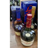 Five bottles to include a boxed Courvoisier V.S. Cognac, 70cl, A boxed Courvoisier V.S.O.P fine
