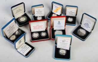 Ten assorted Royal Mint cased silver proof coins, each with certificate of authenticity.