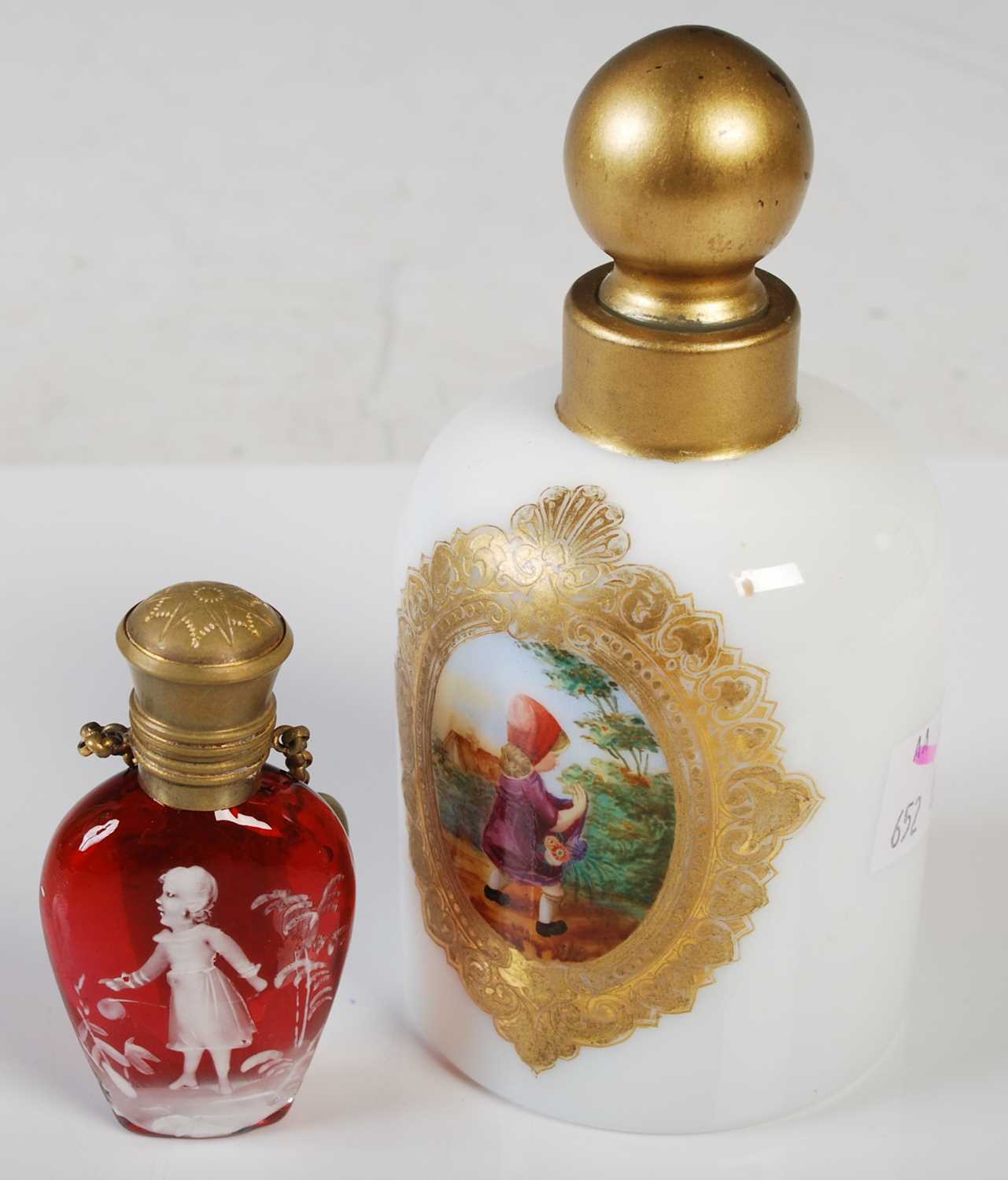 A late 19th century opaque white glass toilet bottle with polychrome painted vignette depicting girl
