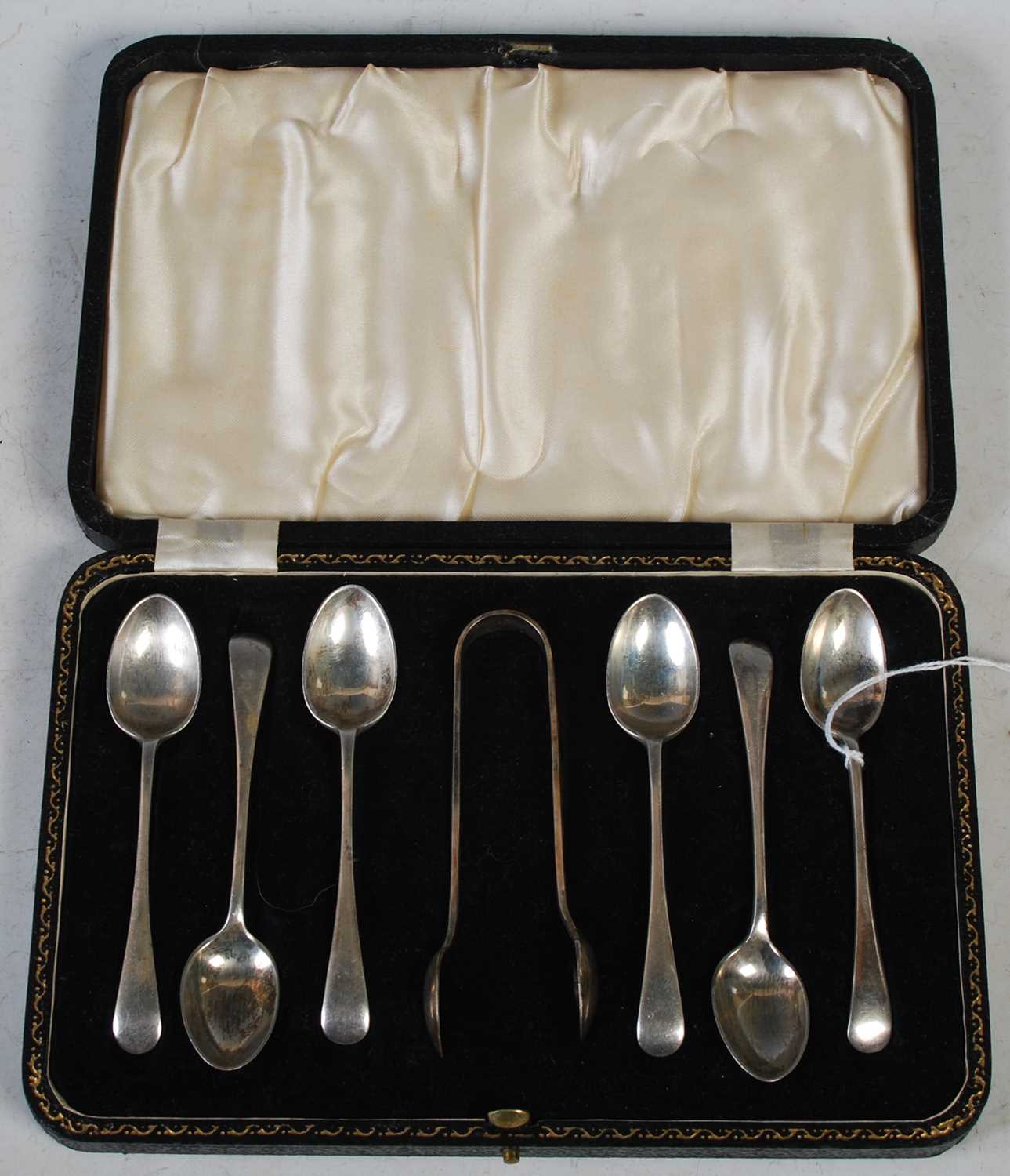 A cased set of six Edwardian silver teaspoons and sugar tongs, Sheffield, 1904.