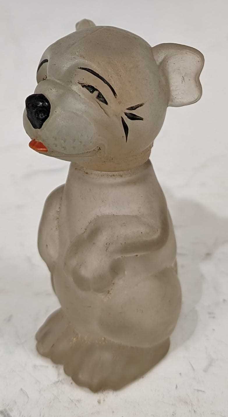 A 20th Century novelty 'Bonzo' the dog pressed glass scent bottle, 7.5cm high.