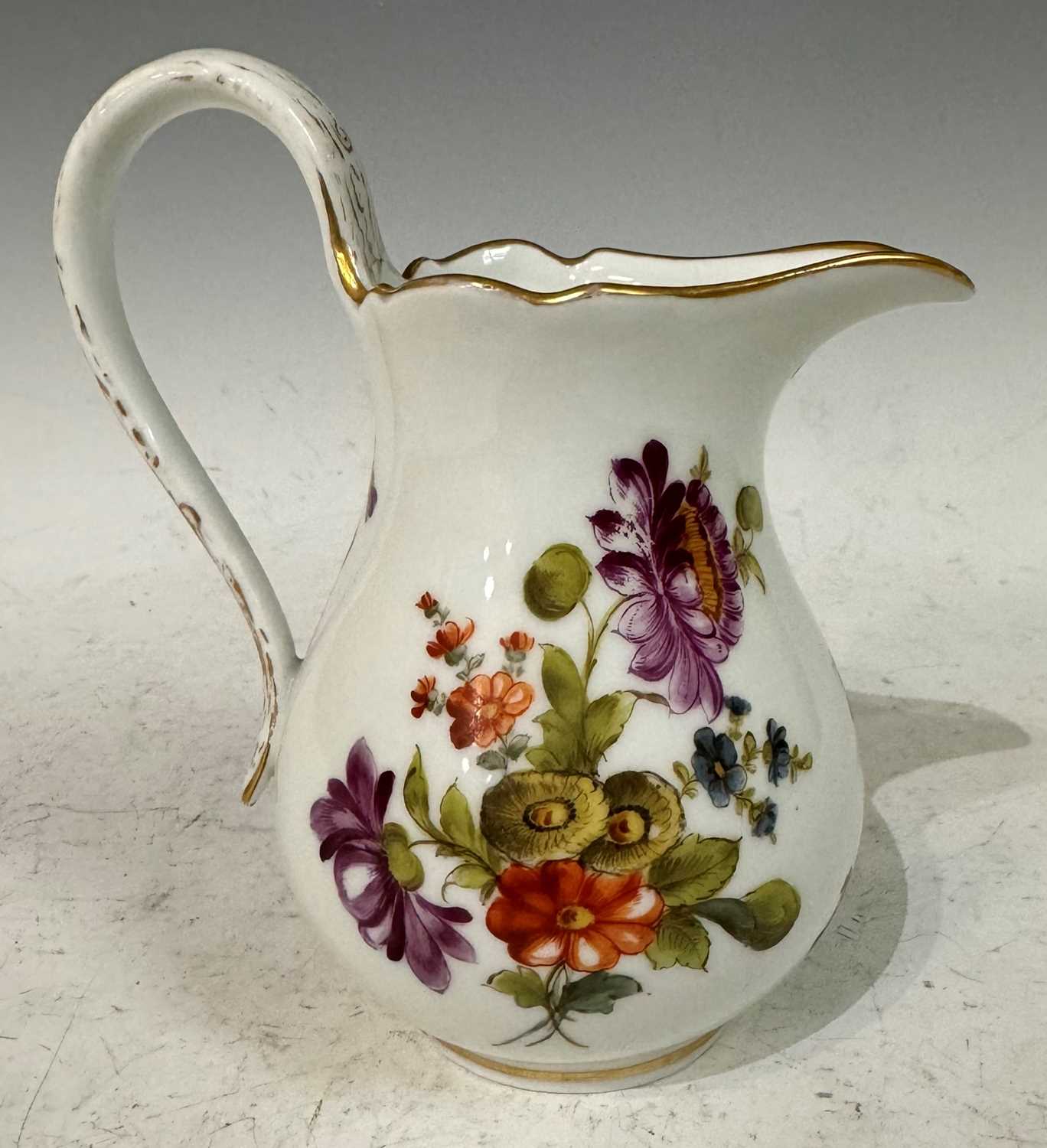 A mid-19th century Meissen style cream jug, with hand painted floral details and gilded accents, - Image 2 of 3