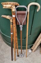 A 'London Style' horn-handled walking cane carved as a recumbent dog, together with two other horn-