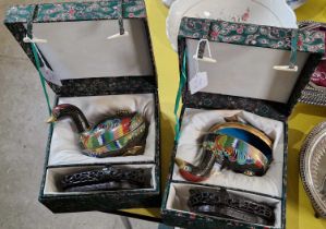 Two Chinese cloisonne duck form trinket boxes and hardwood stands in fitted cases.