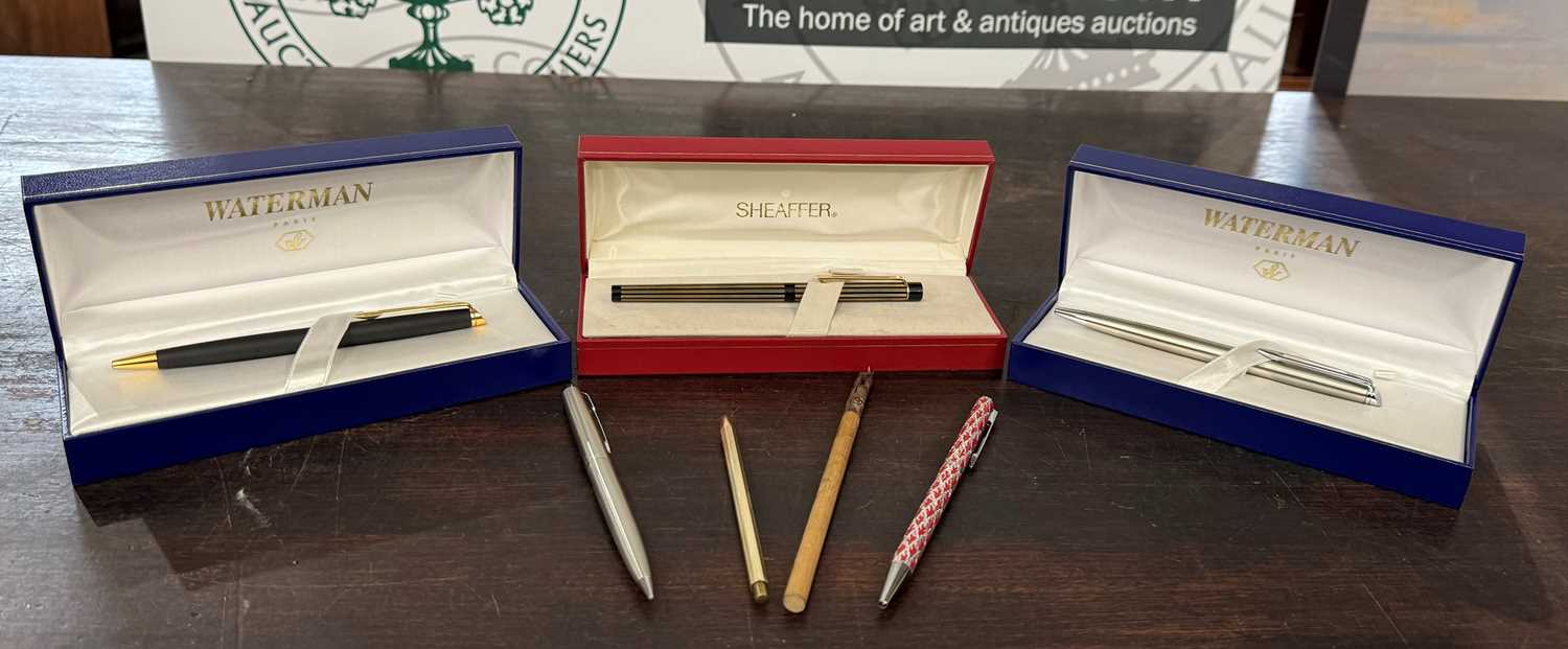 A collection of pens to include Shaker USA fountain pen with 14K nib, two boxed Waterman ball