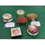 A group of six assorted gilt metal mounted pill/trinket boxes comprising, four continental porcelain