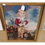 A needlework picture in the Victorian style depicting a boy holding a dog, signed lower left '