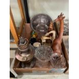 A box of mixed wares to include carved wooden animal figures, parafin lamp base, glassware etc.