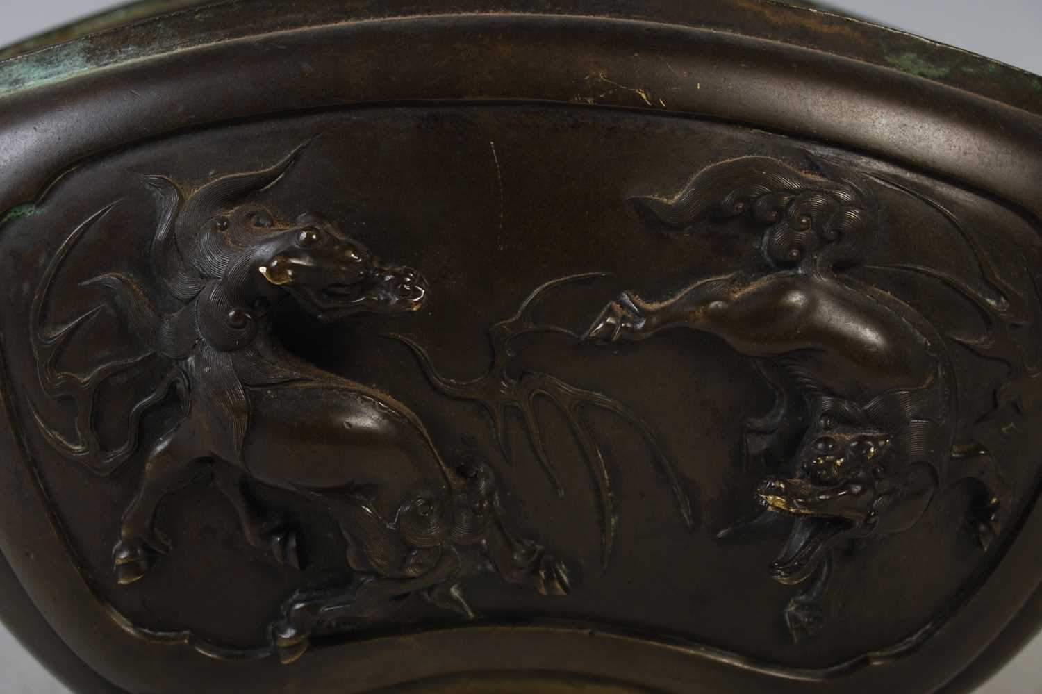 A late 19th century Japanese bronze censor, decorated in relief with Kylin and dragon, the sides - Image 3 of 3