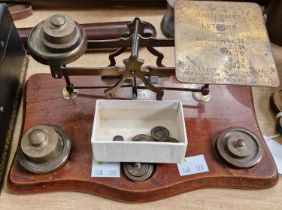 An Early 20th Century set of Postage scales with associated brass weights.