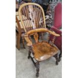 An antique Windsor armchair with bobbin turned detail, 109cm high.