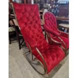 A late 19th / early 20th century brass rocking chair, with red button down velvet upholstered back