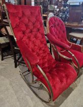 A late 19th / early 20th century brass rocking chair, with red button down velvet upholstered back