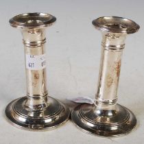 A pair of Edwardian silver candlesticks, Birmingham, 1904, makers mark of RM/EH, 11.5 cm high,