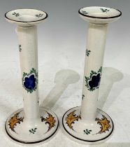 A pair of late 19th Century Wemyss 'Turkey' pattern Scottish pottery candlesticks, with impressed