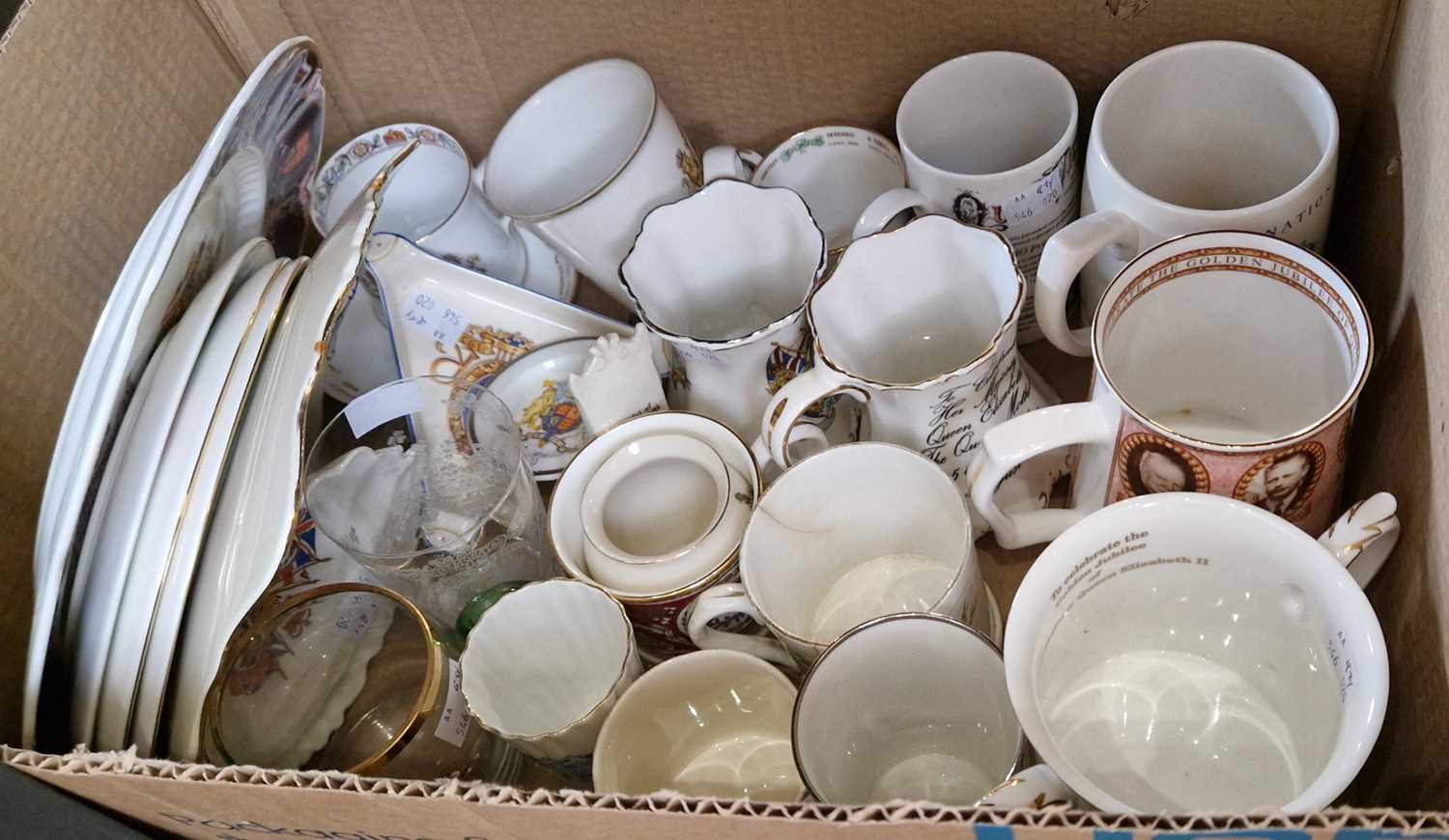 A box of assorted Royal Commemorative wares to include mugs, plates, glasses etc.