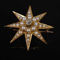 A late 19th century yellow metal diamond and split pearl star brooch, gross weight 9.3 grams,