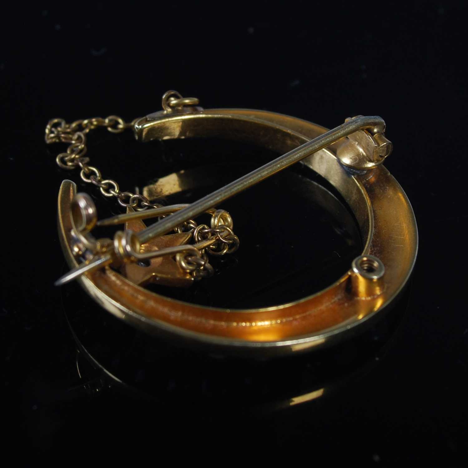 Late 19th century yellow metal diamond and split pearl crescent shaped brooch set with a star, - Image 2 of 2