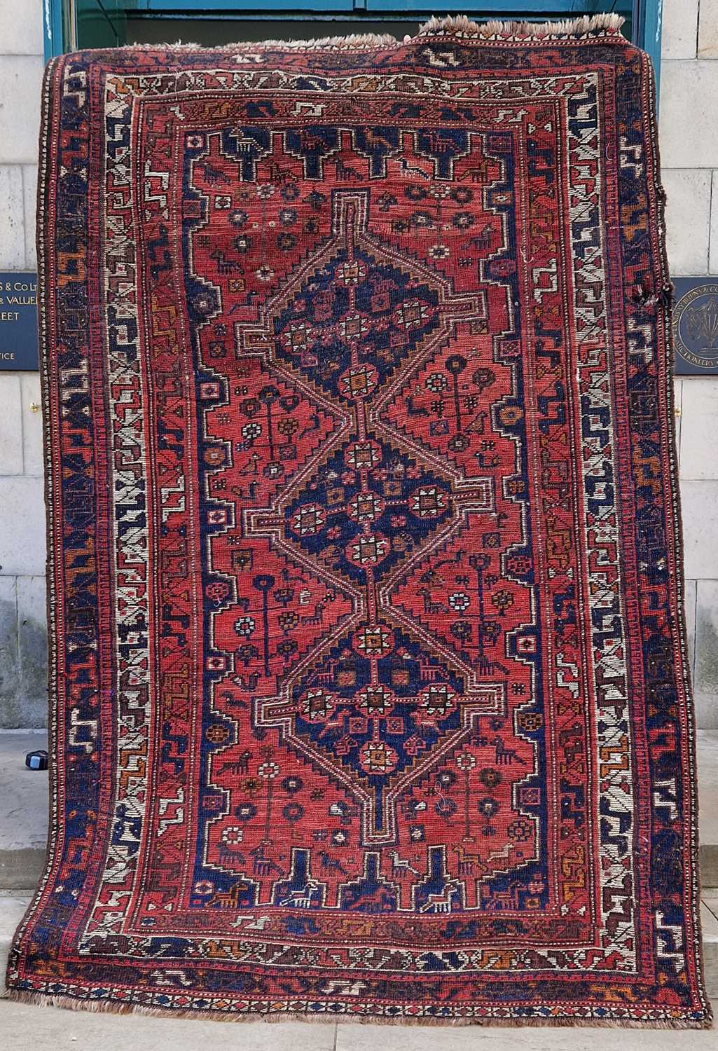 A Persian rug, 20th century, the rectangular field centered with three blue ground lozenge shaped - Image 2 of 5