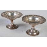 A pair of Birmingham silver pedestal bon bon dishes, embossed with floral garland around the rim,