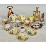 A group of miniature porcelain wares to include a Royal Worcester ivory-ground twin-handled bottle