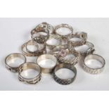 A collection of sixteen assorted silver and white metal dress rings.