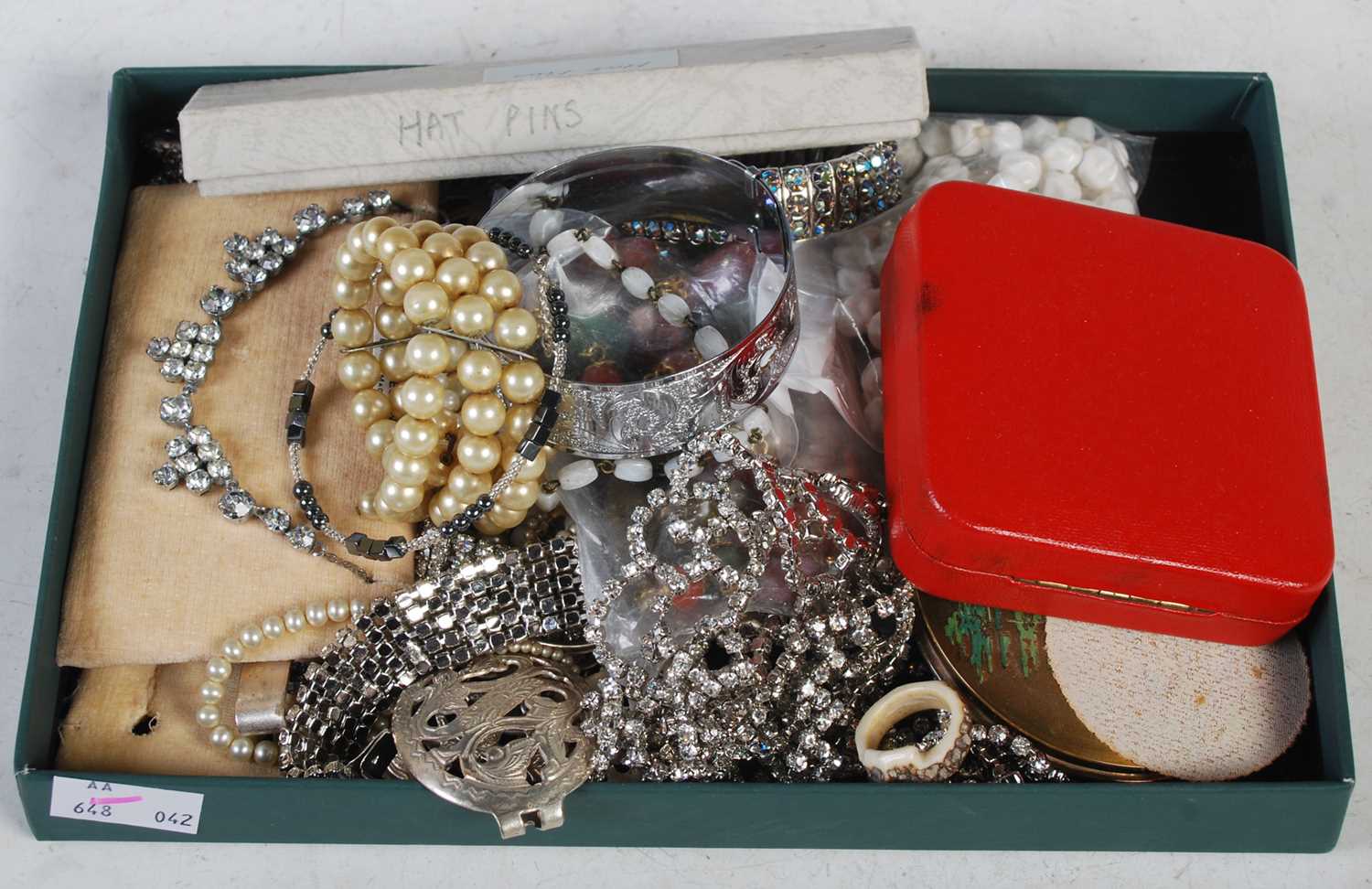 A box of assorted costume jewellery.