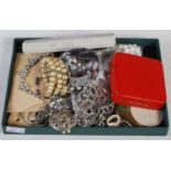 A box of assorted costume jewellery.