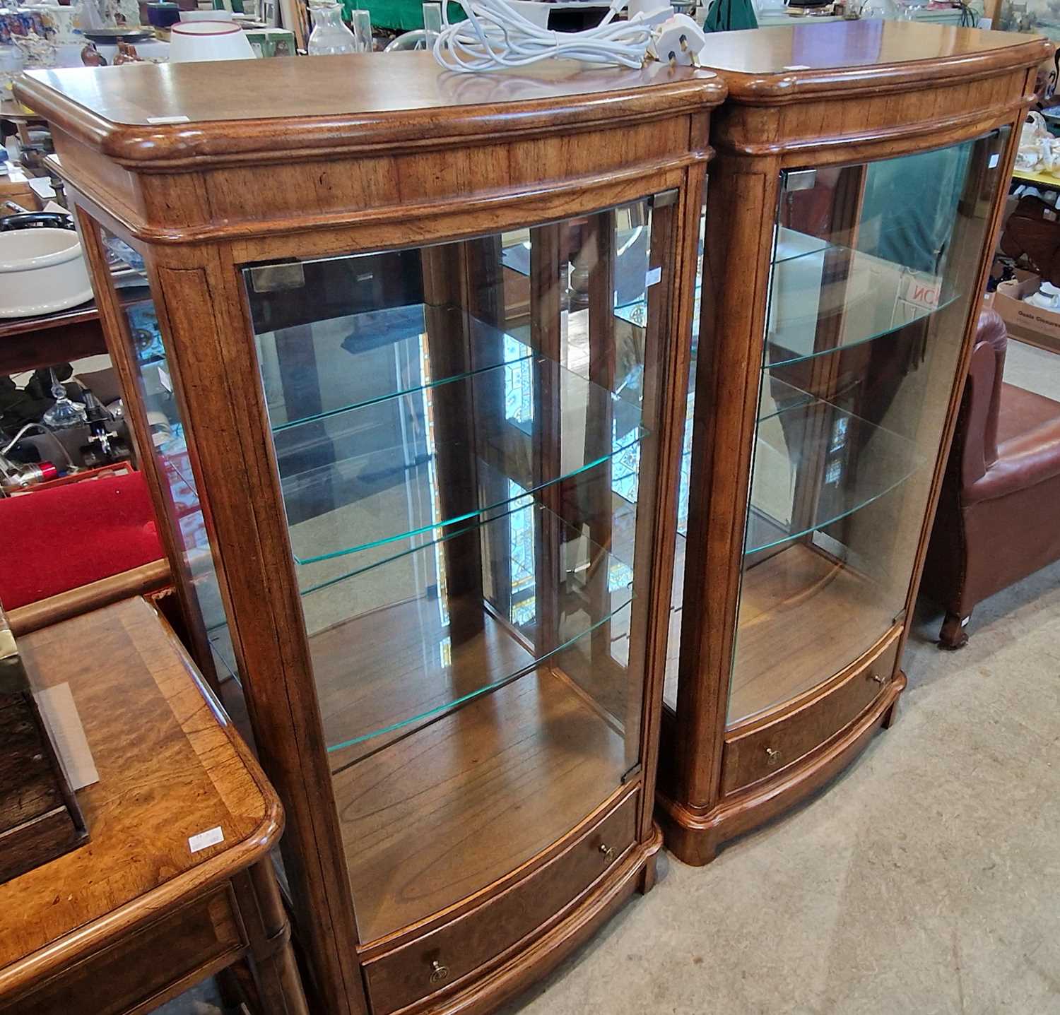 A pair of John Lewis burr walnut mirror back bow front display cabinets, 62cm wide x 132cm high.