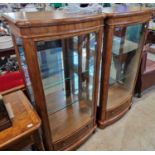 A pair of John Lewis burr walnut mirror back bow front display cabinets, 62cm wide x 132cm high.