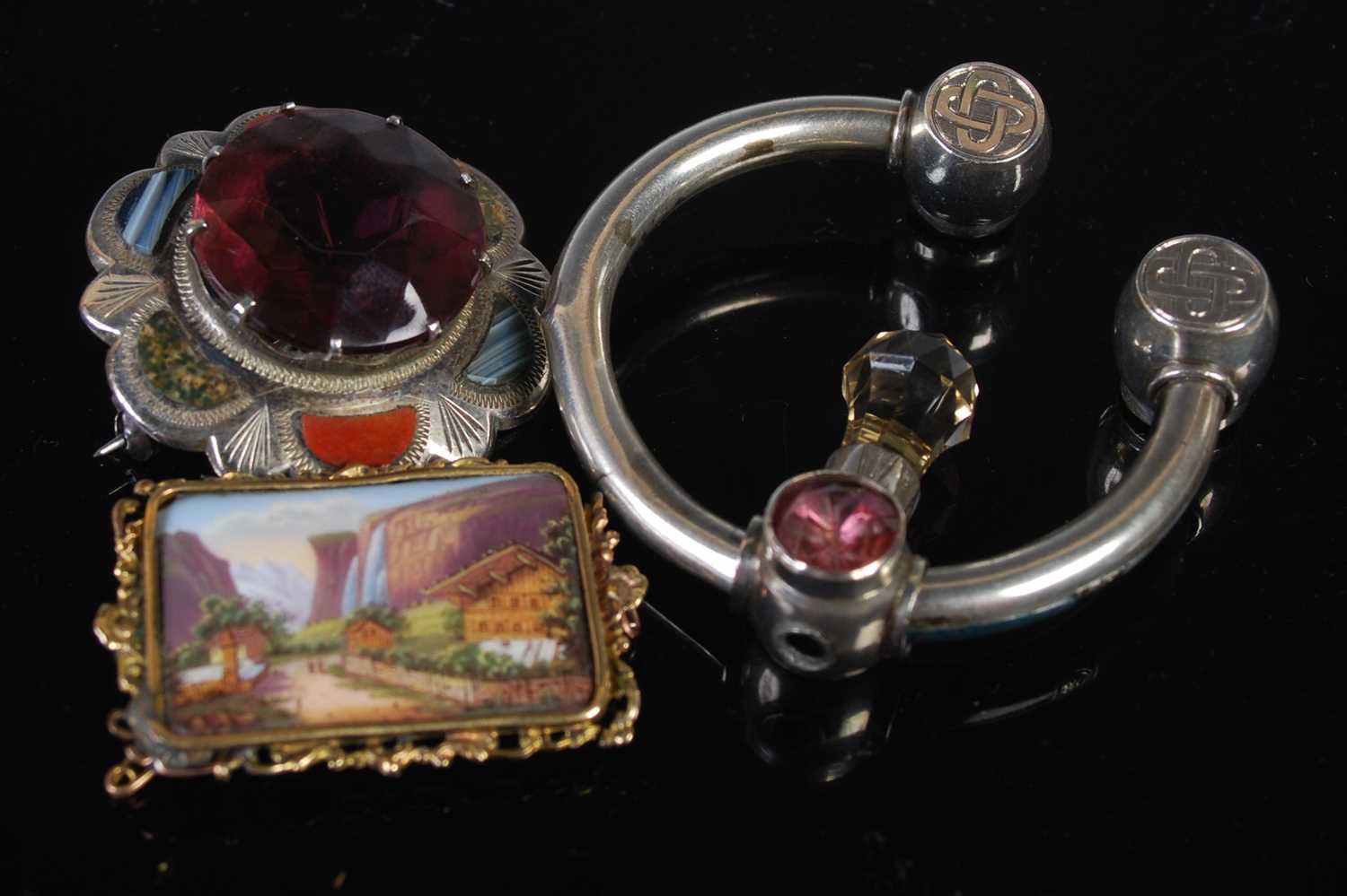 A Glasgow silver pebble set and semi-precious stone set brooch together with a white metal, pebble