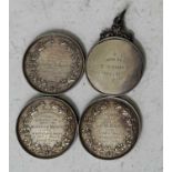 Three Edwardian Royal Dublin Society white metal medallions of equine interest, together with a