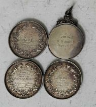 Three Edwardian Royal Dublin Society white metal medallions of equine interest, together with a