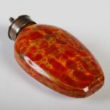 A Chinese white metal mounted glass snuff bottle imitating Realgar, 7.5 cm high.