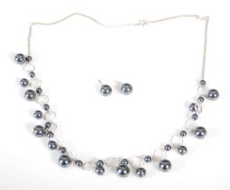 A silver and pearl necklace together with a matching pair of earrings, necklace 45cm long, gross