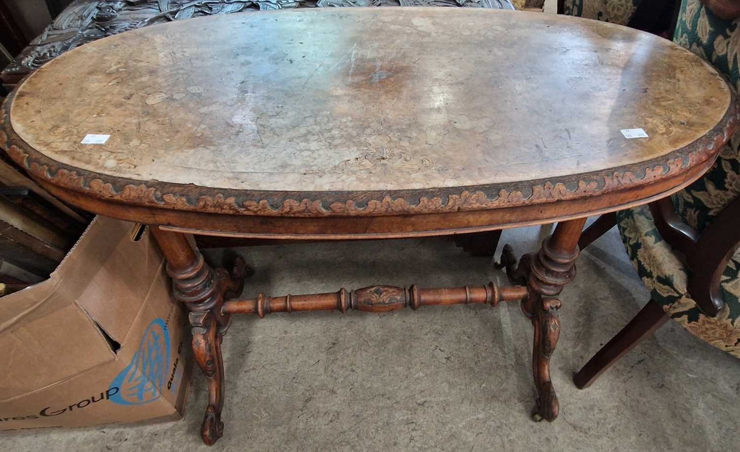 A Victorian walnut and marquetry inlaid oval table (distressed) 95cm wide.